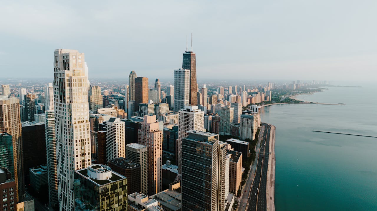 home-hero Stunning aerial view of the Chicago skyline along Lake Michigan, showcasing tall skyscrapers and beautiful skyline.