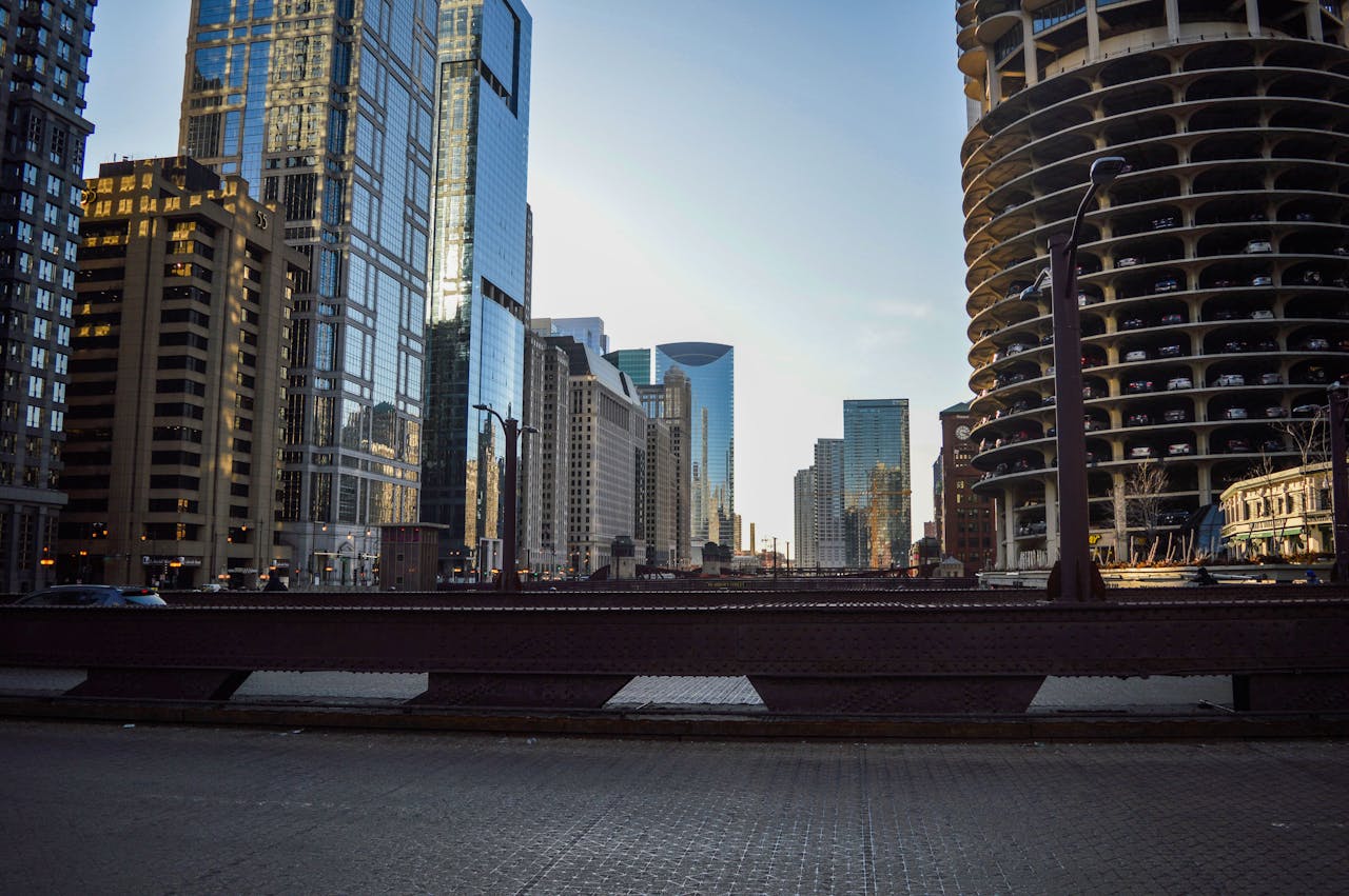 services-01 Stunning view of Chicago's modern skyline from a city bridge, featuring iconic skyscrapers.
